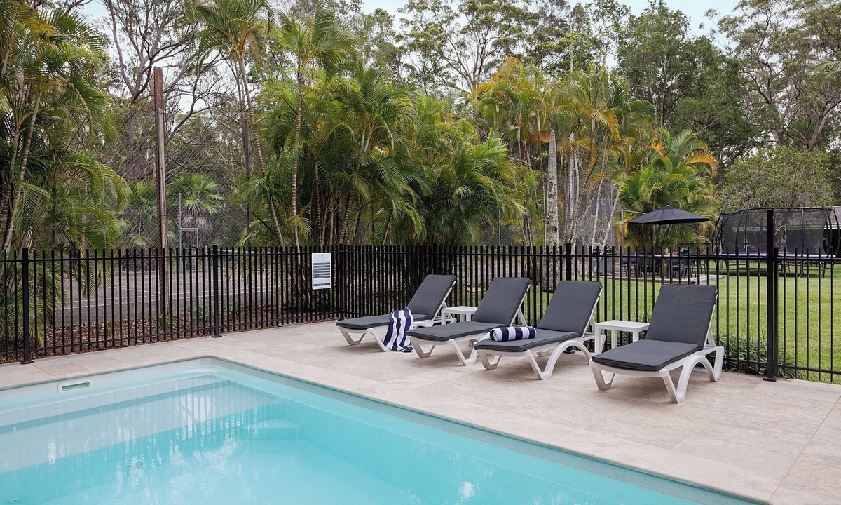 Charlotte Bay House | Coastal two acre escape with pool and tennis court. Pet friendly.