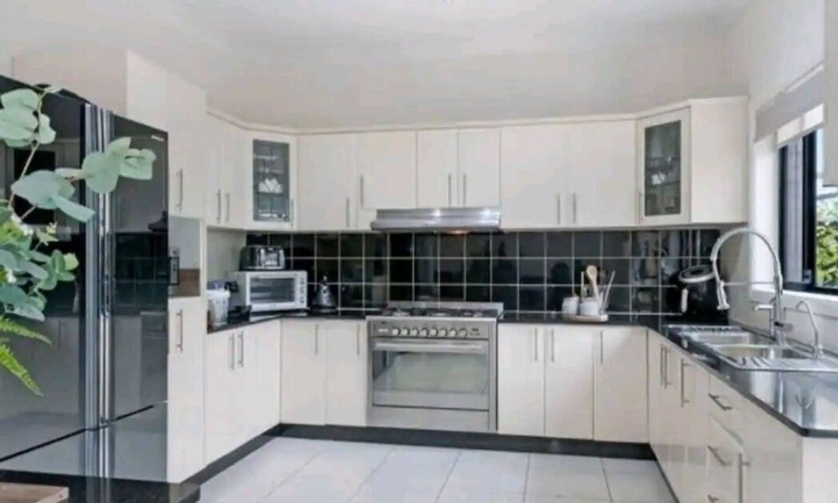 Merrylands House | Family room with shared facilities kitchen, laundry, bathroom and living area.
