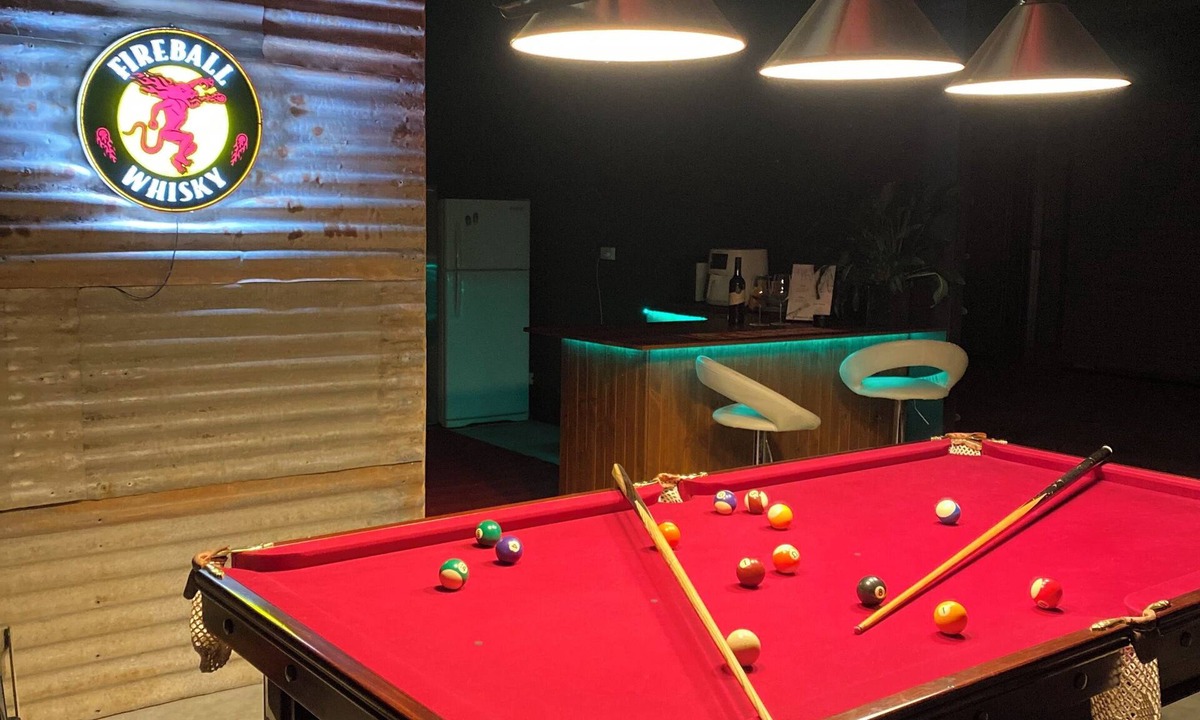 Mount Doran House | Man Cave with a touch of Lux. and an open fire.
