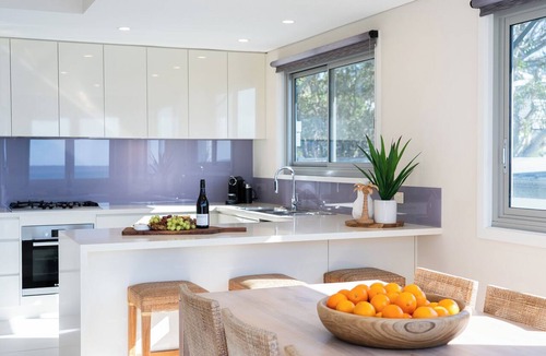 Hyams Beach House | Allure: Panoramic beachfront views. Sunrise views over the ocean at Hyams Beach