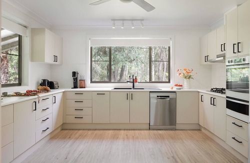 Charlotte Bay House | Coastal two acre escape with pool and tennis court. Pet friendly.