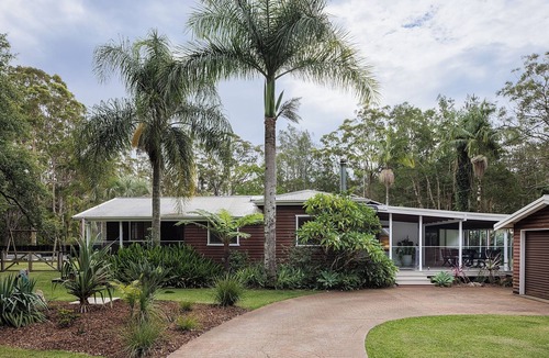 Charlotte Bay House | Coastal two acre escape with pool and tennis court. Pet friendly.