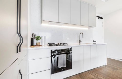 Brunswick Apartment | Concrete Junction Sunny Industrial Balcony Haven