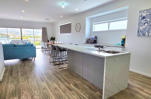 Hayborough House | Driftwood & Daydreams: Modern Coastal with Hillside Views & a Swim Spa