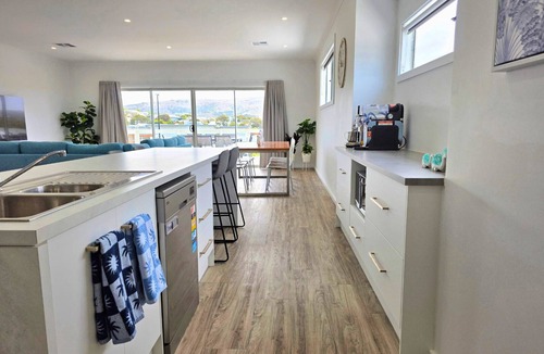 Hayborough House | Driftwood & Daydreams: Modern Coastal with Hillside Views & a Swim Spa