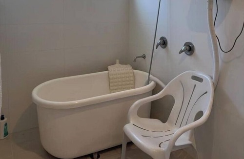 Doubleview House | master bedroom shared bathroom