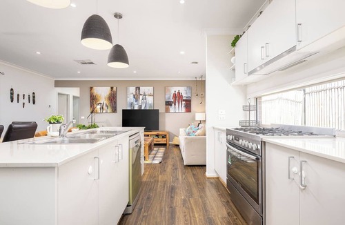 Clyde North House | Modern Family Retreat Home with Sunroom