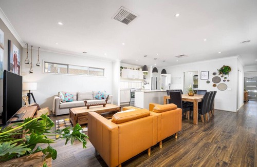 Clyde North House | Modern Family Retreat Home with Sunroom