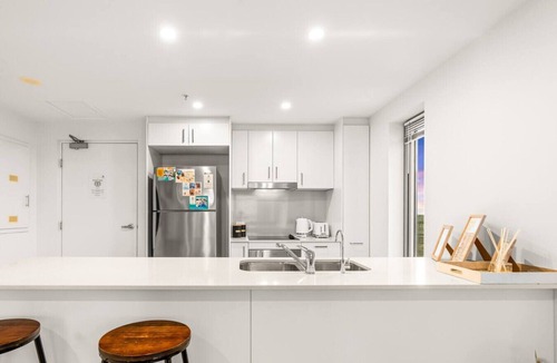 Darwin City Centre Condo | Reef-side Splendor: City Vistas ~ Pool ~ Workspace
