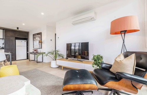 Abbotsford Condo | Riverside top-floor apartment with Yarra views