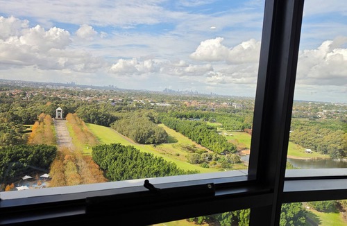 Sydney Olympic Park Apartment | Sky-High 3BR Oasis: City/Park View & Two Secure Parking Spots