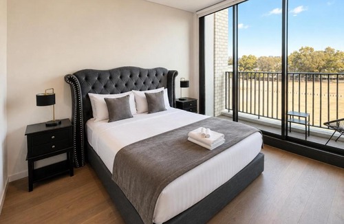 Lidcombe Apartment | Spacious Pool Retreat with Gym Pool BBQ Rooftop