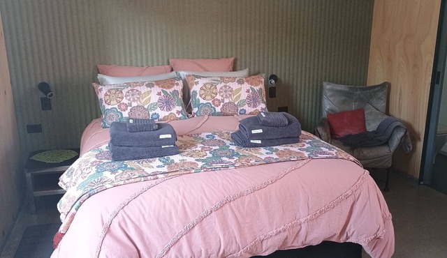 Cozy studio with trendy design, fully equipped kitchen, & modern bathroom.