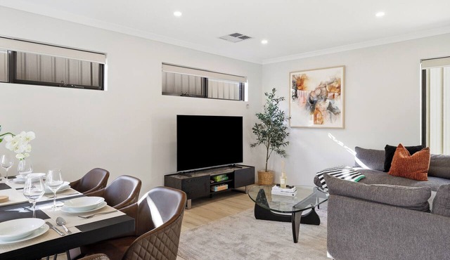 Newly built two-storey townhouse in the heart of Bentley — ideal for families, groups & corporate stays. Modern interiors, gourmet kitchen, private alfresco & a Nespresso on us.