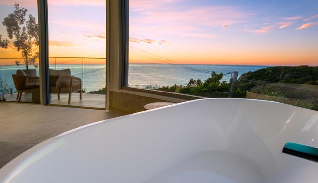 Oceanfront luxury apartment with views, king bed & private balcony in Coolum Beach
