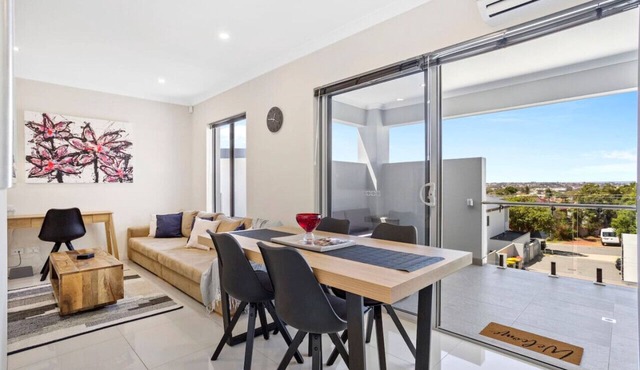 Stylish urban oasis with balcony & street views!